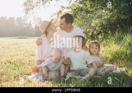 Happy family enjoying together in nature Stock Photo