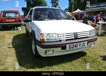 A 1990 Peugeot 205 GTI parked on display at the 47th Historic Vehicle Gathering, Powderham, Devon, England, UK. Stock Photo