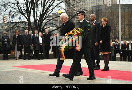 Ottawa, Canada. 23rd Apr, 2023. German President Frank-Walter Steinmeier (l) lays a wreath at the Tomb of the Unknown Soldier at the Confederation Square National War Memorial. His wife Elke Büdenbender and Ahmed Hussen, member of the Canadian House of Commons stand behind him. The aim of the trip is to strengthen German-Canadian relations in difficult political and economic times. Credit: Britta Pedersen/dpa/Alamy Live News Stock Photo