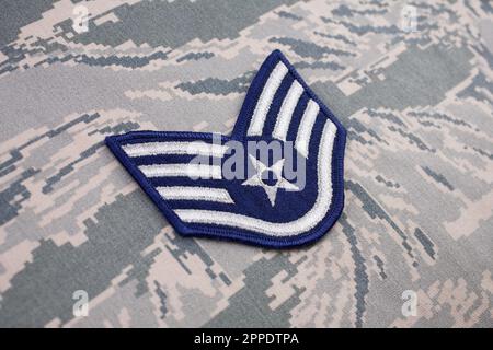 August 31, 2020. US AIR FORCE Staff Sergeant rank patch on digital tiger-stripe pattern Airman Battle Uniform (ABU) Stock Photo