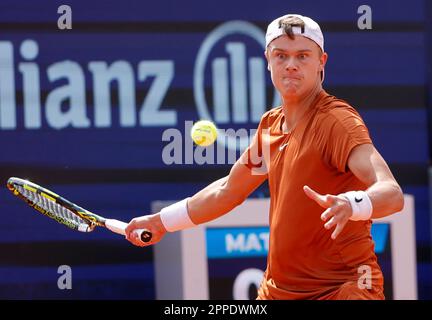 Munich, Germany. 23rd Apr, 2023. Holger Rune of Denmark hits a return to Botic van de Zandschulp of the Netherlands during the men's singles final match at the BMW Open 2023 in Munich, Germany, on April 23, 2023. Credit: Philippe Ruiz/Xinhua/Alamy Live News Stock Photo