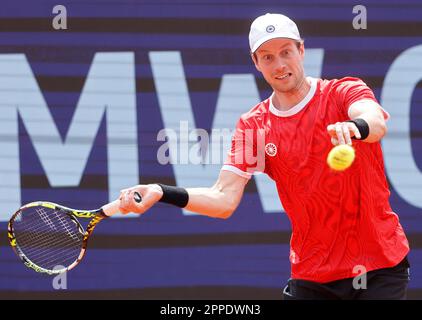 Munich, Germany. 23rd Apr, 2023. Botic van de Zandschulp of the Netherlands hits a return to Holger Rune of Denmark during the men's singles final match at the BMW Open 2023 in Munich, Germany, on April 23, 2023. Credit: Philippe Ruiz/Xinhua/Alamy Live News Stock Photo