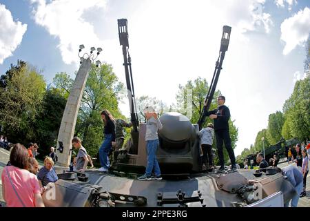 Bucharest, Romania. 23rd Apr, 2023. Children have fun on an armoured vehicle at a static exhibition of military equipment marking Romanian Land Forces Day at a park in Bucharest, capital of Romania, April 23, 2023. Credit: Cristian Cristel/Xinhua/Alamy Live News Stock Photo