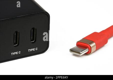 Close up of a USB type c cable and type c port adapter isolated on white background, Mobile phone equipment concept. Stock Photo