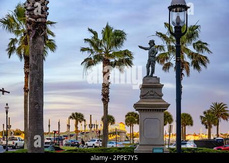 Statue of Juan Ponce de Leon in Ponce de Leon Circle along A1A in Historic Downtown St. Augustine, Florida, on Matanzas Bay at sunset. (USA) Stock Photo