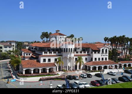 COSTA MESA, CALIFORNIA - 23 APR 2023: Newport Plaza, a prominant office building with Spanish Architecture adjacent to Triangle Square. Stock Photo