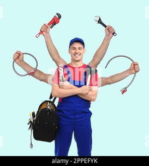 Plumber with different tools on light blue background. Multitasking handyman Stock Photo