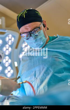 plastic surgeon operates on a patient in the operating room Stock Photo -  Alamy