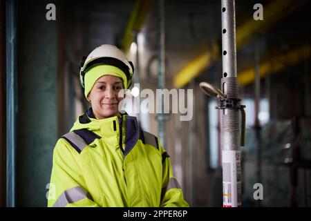 Portrait of smiling female engineer at construction site Stock Photo