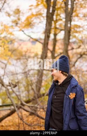 Smiling young man looking away Stock Photo
