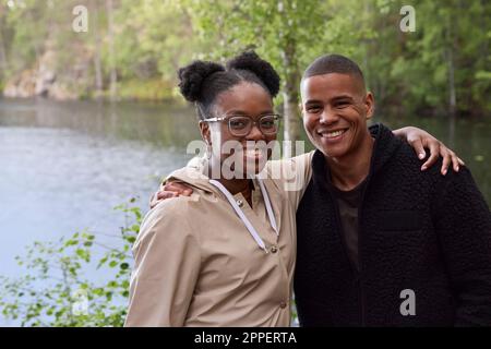 Smiling friends looking at camera Stock Photo