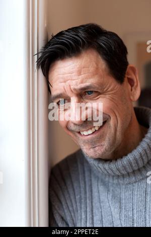 Smiling man looking away Stock Photo
