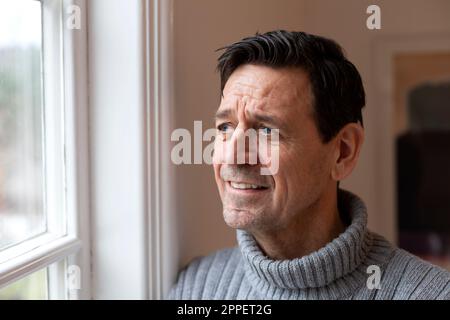Smiling man looking away Stock Photo