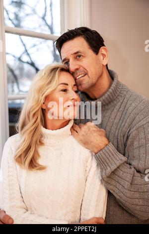Smiling couple sitting together Stock Photo
