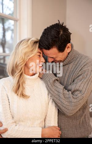 Smiling couple sitting together Stock Photo