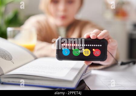 Child holding educational electronic game Stock Photo