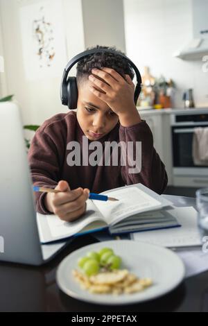 Boy doing homework at home Stock Photo