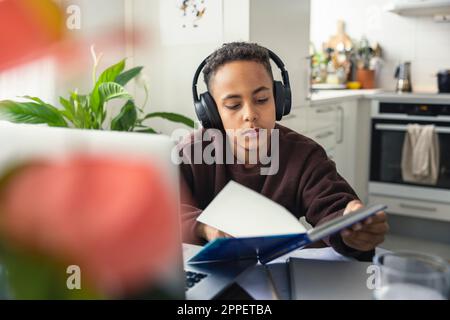 Boy doing homework at home Stock Photo