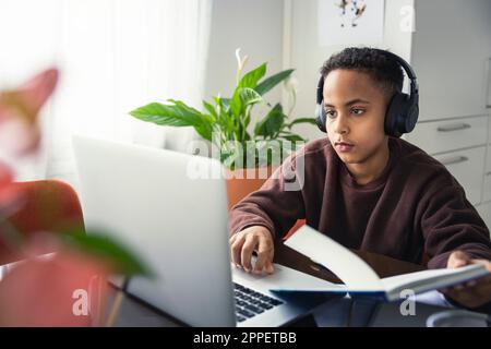 Boy doing homework at home Stock Photo
