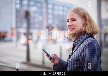Young woman using cell phone Stock Photo