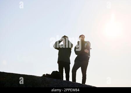 Low angle view of men standing together Stock Photo