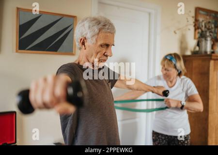 Senior couple exercising at home Stock Photo