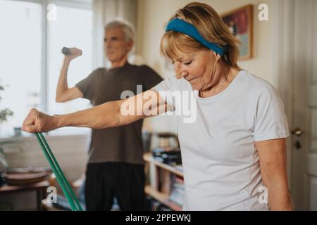 Senior couple exercising at home Stock Photo