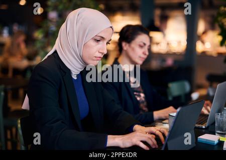 Businesswoman using digital tablet in cafe Stock Photo