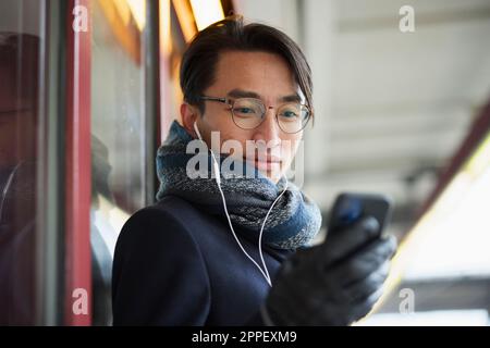 Smiling man holding cell phone Stock Photo