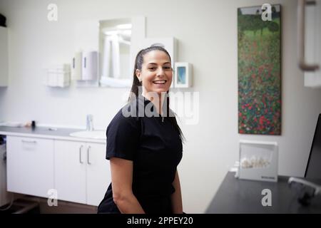 Female dentist standing in office Stock Photo