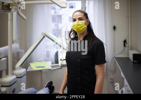 Female dentist standing in office Stock Photo