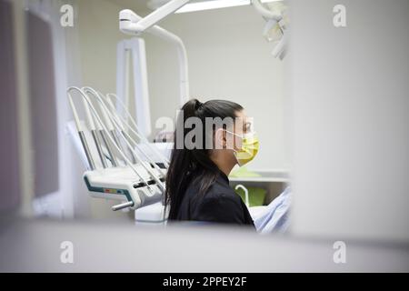 Female dentist standing in office Stock Photo