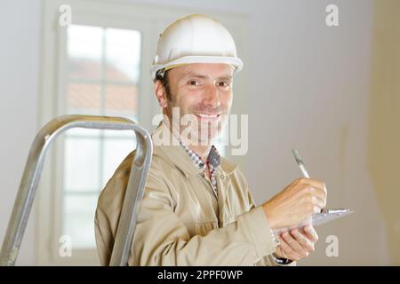 man builder in hard hat looking at camera Stock Photo