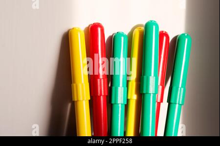 felt-tip pens in red green and yellow Stock Photo