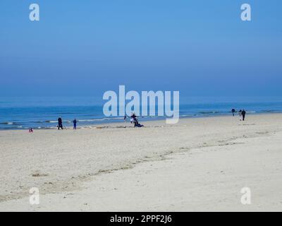 People, families, along the coast of Northern France, enjoying the beach at Berck-sur-Mer in April. Stock Photo