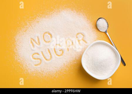 Flat lay composition with phrase No Sugar on yellow background Stock Photo