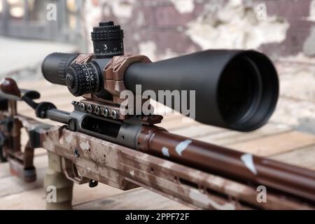 Closeup view of modern powerful sniper rifle with telescopic sight outdoors Stock Photo