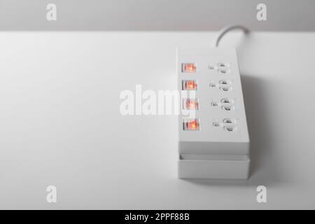 Electrical power strip isolated over white background. Stock Photo