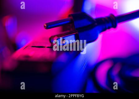 Close up 3-leg plug on electrical power strip. Stock Photo