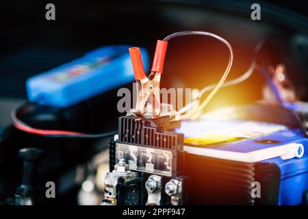 Checking a car battery level with car battery checker, car repairing concept Stock Photo