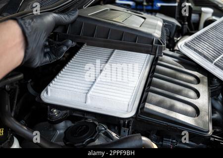 Changing car air filter, close up at the new and clean air filter. Car maintenance concept. Stock Photo