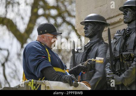 London, England, UK. Man carrying out cleaning / restoration of Guards Division War Memorial on  Horse Guards Road, with a blowtorch Stock Photo