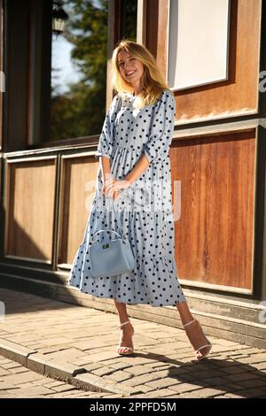 Light blue dress top with black polka dots