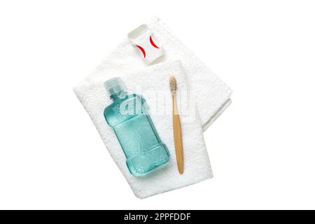 Mouthwash and other oral hygiene products isolated on white backgroundtop view with copy space. Flat lay. Dental hygiene. Oral care products and space Stock Photo