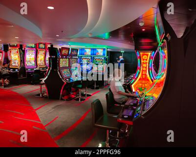 Miami, USA - April 29, 2022: Interior of slot machines in gambling casino on board new cruise ship or new flagship of MSC Seashore Stock Photo