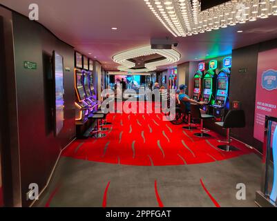 Miami, USA - April 29, 2022: Interior of slot machines in gambling casino on board new cruise ship or new flagship of MSC Seashore Stock Photo