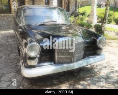 Stanisici, Bijelina, BiH, 25 April 2021. Retro or vintage style. Car Mercedes Benz Ponton in black with silver trimmings. Nice car. Retro car in good condition. Product of the German car industry Stock Photo