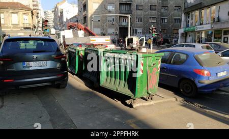 Belgrade, Serbia. January 24, 2020. Garbage containers in the city center. Roadway with cars. Asphalt road with passers-by. An editorial shot of Balkansk street. Stock Photo