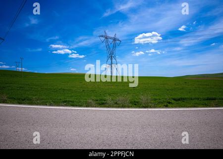 High voltage towers, under the blue sky white clouds at february Stock ...