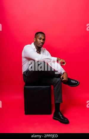 Happy african american young businessman in formal suit. Smiling confident black guy Stock Photo